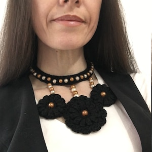 Crochet choker and bib style necklace with flower design and bronze beads