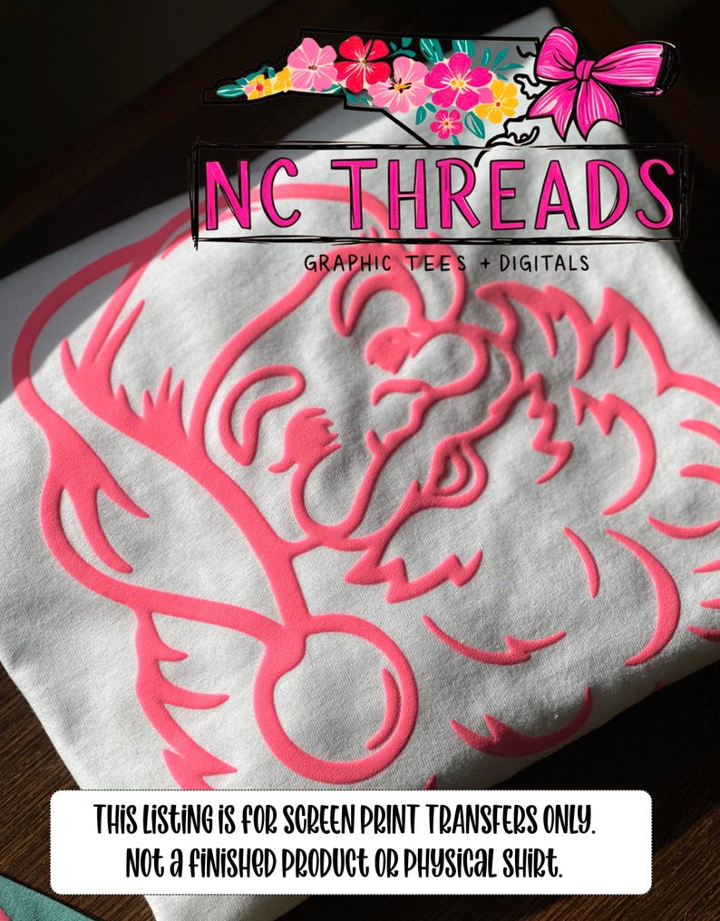 May include: White t-shirt with a large, raised pink design. The design appears to be a stylized floral or abstract shape. The text "NC THREADS GRAPHIC TEES + DIGITALS" is above the design. The bottom of the image has the text "THIS LISTING IS FOR SCREEN PRINT TRANSFERS ONLY. NOT A FINISHED PRODUCT OR PHYSICAL SHIRT."