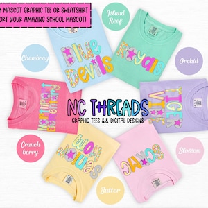 May include: A flat lay of ten different colored t-shirts with colorful text and star designs. The shirts are arranged in a circle with the text "NC THREADS GRAPHIC TEES & DIGITAL DESIGNS" in the center. The colors of the shirts are pink, blue, yellow, green, and purple.