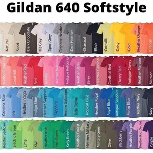 May include: A color chart of Gildan 640 Softstyle t-shirts. The image displays a variety of colors, including white, black, and various shades of blue, green, red, and yellow. The text "Gildan 640 Softstyle" is at the top.