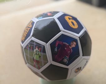 May include: A custom soccer ball featuring alternating black panels and white panels printed with photographs of a soccer player in a red jersey, a player in a lime green jersey, the number 6 in yellow, and the name Hayden in yellow text.