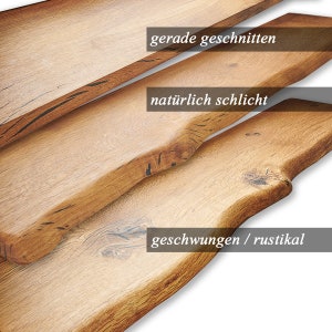 May include: Three wooden shelves, each with a different edge style. The top shelf is straight, the middle shelf is slightly curved, and the bottom shelf is more dramatically curved. The text "gerade geschnitten" is on the top shelf, "nat&uuml;rlich schlicht" is on the middle shelf, and "geschwungen / rustikal" is on the bottom shelf.