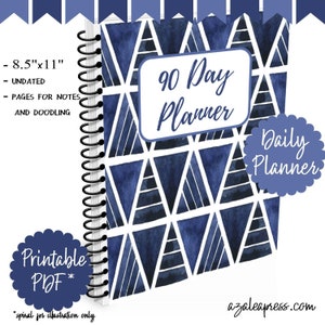 May include: A printable 90-day planner with a blue and white geometric pattern. The planner is 8.5 inches by 11 inches and is undated. It includes pages for notes and doodling. The text "Daily Planner" is in a circle on the cover.