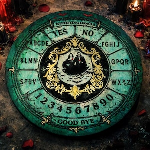 May include: A round, antique-style Ouija board with a distressed teal finish. The board features letters, numbers, and the words "YES," "NO," and "GOOD BYE." A central image depicts a couple and bats, framed by ornate gold detailing. Candles and rose petals surround the board.