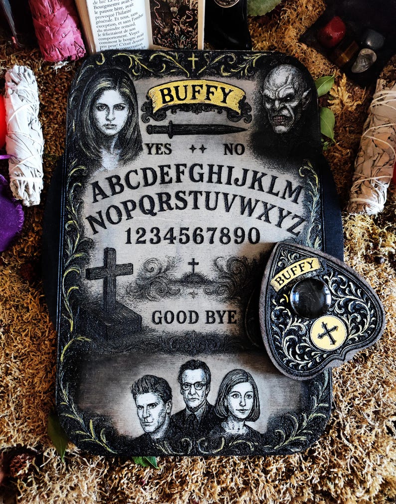 May include: A decorative, rectangular Ouija board with the word "BUFFY" in a banner at the top. The board features portraits, letters, numbers, and the words "YES" and "NO". A heart-shaped planchette is included.