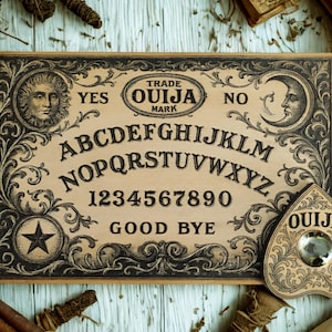 May include: A vintage Ouija board with a planchette. The board features the alphabet, numbers, and the words "Yes," "No," and "Good Bye." Ornate black and white illustrations frame the board, with a sun and moon design. The planchette is heart-shaped.