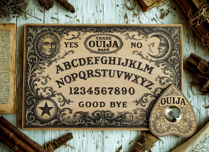 May include: A vintage Ouija board with a planchette. The board features the alphabet, numbers, and the words "Yes," "No," and "Good Bye." Ornate black and white illustrations frame the board, with a sun and moon design. The planchette is heart-shaped.