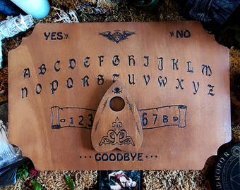 Ouija board, Ouija board, Ouija planchette, spiritualism, occult, divination board, Ouija board, table
