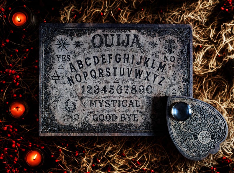 May include: A vintage Ouija board with a planchette. The board is wooden with engraved letters, numbers, and symbols. The word "OUJIA" is at the top. The planchette is dark with a clear viewing window. The board is surrounded by candles.