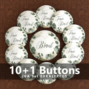 Könnte beinhalten: Ein Set aus elf weißen Knöpfen mit den Schriftzügen "Team Brant" und "Brant" in eleganter Schrift, umgeben von einem grünen Eukalyptusblatt-Design. Der Text "10+1 Buttons" ist unten zu sehen.