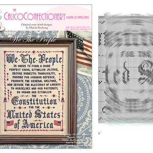 May include: A cross stitch pattern featuring the Preamble to the United States Constitution in black and red lettering on a beige background, framed in dark wood. The design includes two small American flags and decorative red star accents.