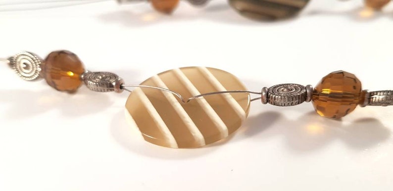 Necklace in brownbeige jewelry wire buttons and beads