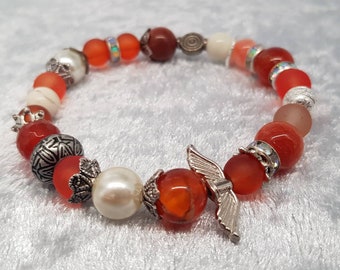 Engel-Armband aus einem Perlenmix in Orange, Modeschmuck, christlicher Schmuck, christliches Armband, elastisch, dehnbar