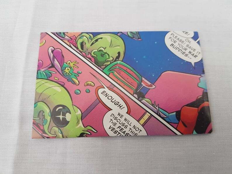 May include: A comic book panel featuring a green alien with a large eye and a pink background. The alien is saying "ENOUGH! WE WILL NOT DISCUSS THIS THE FEAST VESTI".  Another alien is saying "PLEASE SAVE IT FOR YOUR WAR BUDDIES-- OH!"