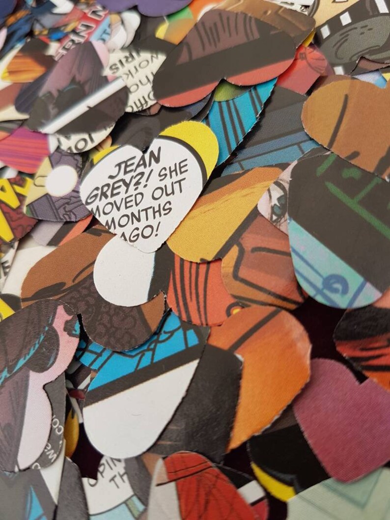 May include: A pile of colourful heart-shaped paper cutouts with comic book images and text. One heart reads "JEAN GREY?! SHE MOVED OUT MONTHS AGO!"