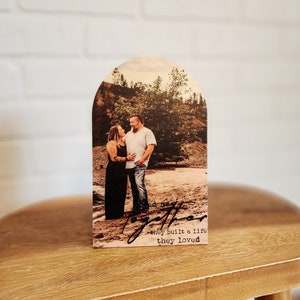 Boho style Arch wood cutout with custom printed photo directly to the wood with the phrase "and so together they built a life they loved" Includes photo stand to sit on desk.