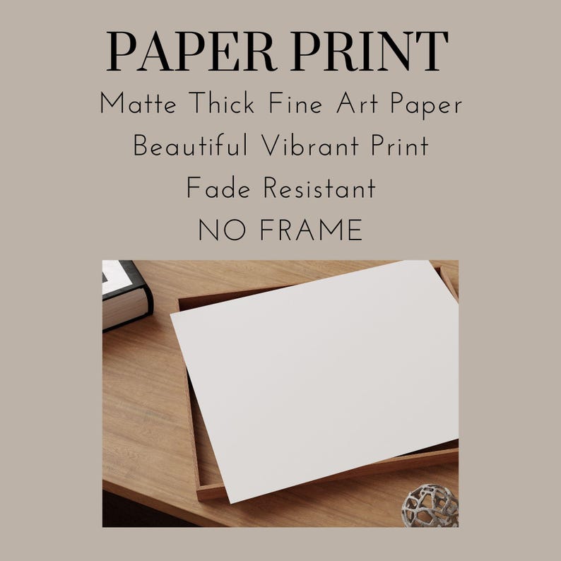 May include: A white paper print on a wooden surface. The print is framed with a thin wooden frame. The text "PAPER PRINT" is at the top of the image. Below the text, it says "Matte Thick Fine Art Paper", "Beautiful Vibrant Print", "Fade Resistant", and "NO FRAME".