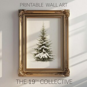 May include: A printable wall art print featuring a snowy evergreen tree in a gold ornate frame. The print is titled "THE 19TH COLLECTIVE".