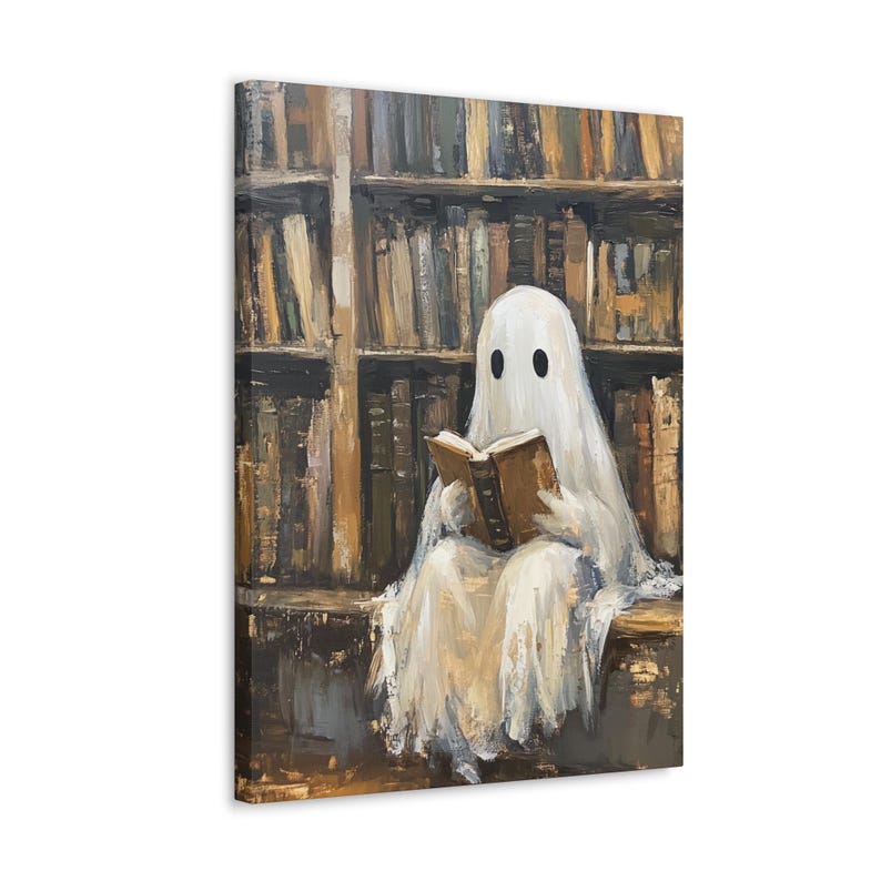 May include: A white ghost wearing a sheet sits in a library reading a book. The ghost has two black eyes and is sitting on a wooden bench. The library shelves are filled with books.