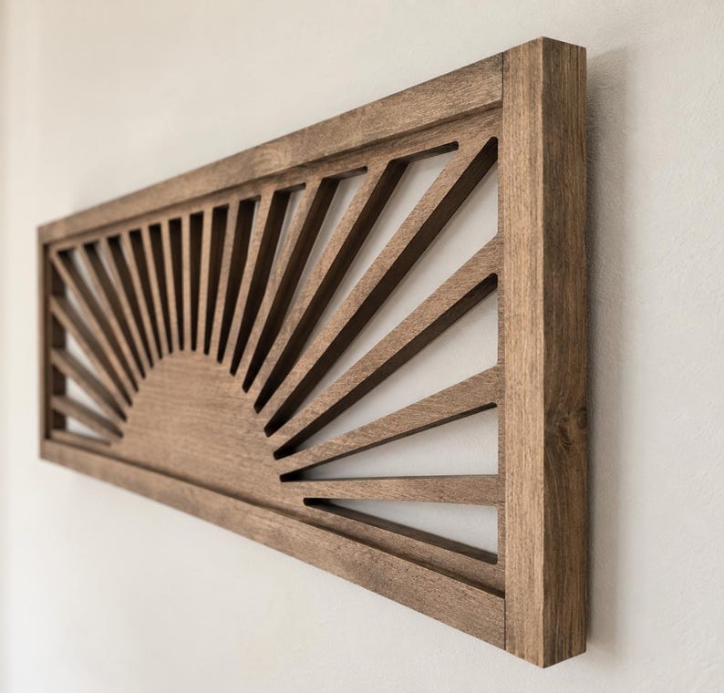 Cuadro de pared estilo boho con diseño de sol en madera, decoración minimalista con temática de amanecer.
