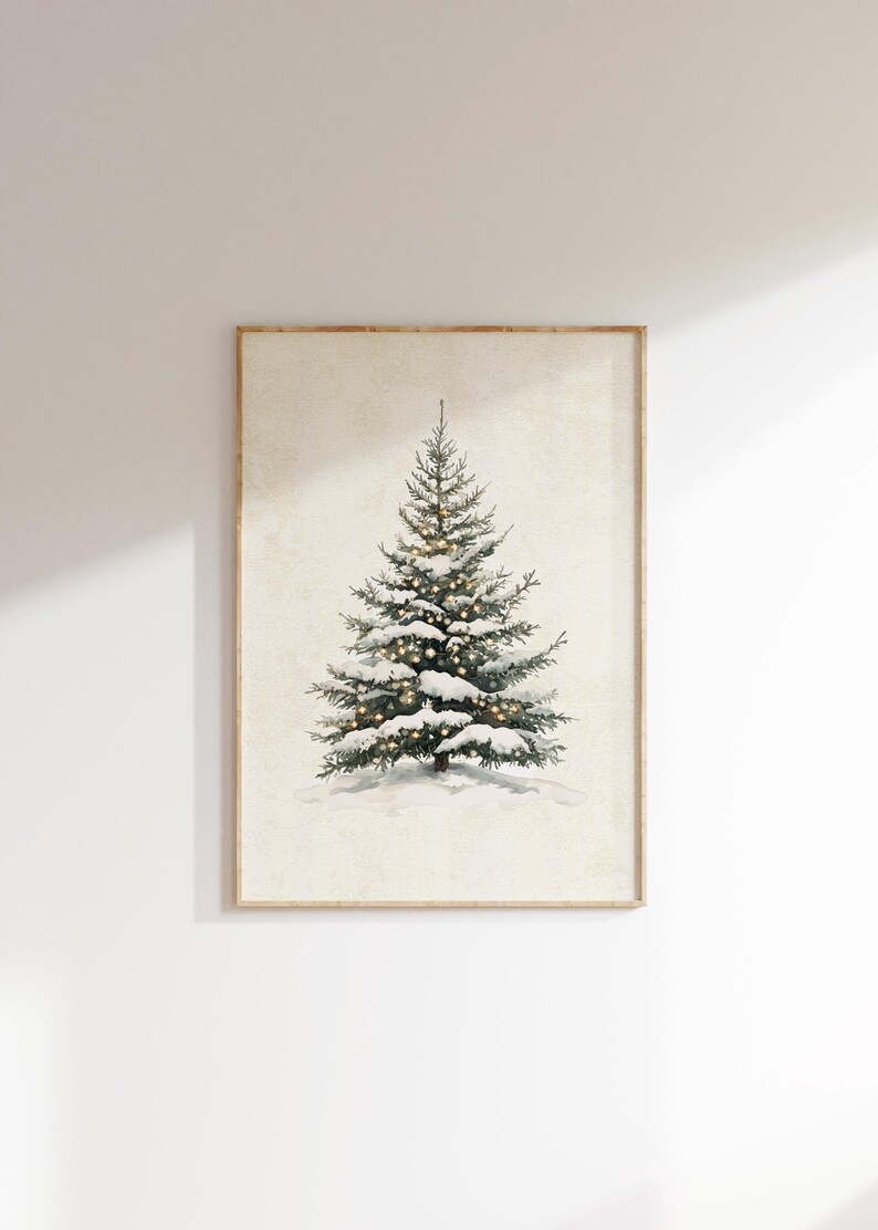May include: A framed watercolor painting of a snow-covered evergreen tree with white lights strung through the branches.
