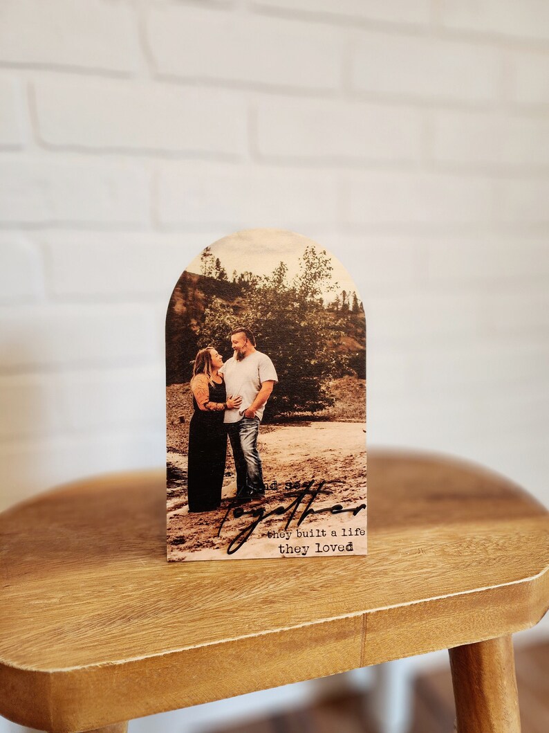 Boho style Arch wood cutout with custom printed photo directly to the wood with the phrase "and so together they built a life they loved" Includes photo stand to sit on desk.