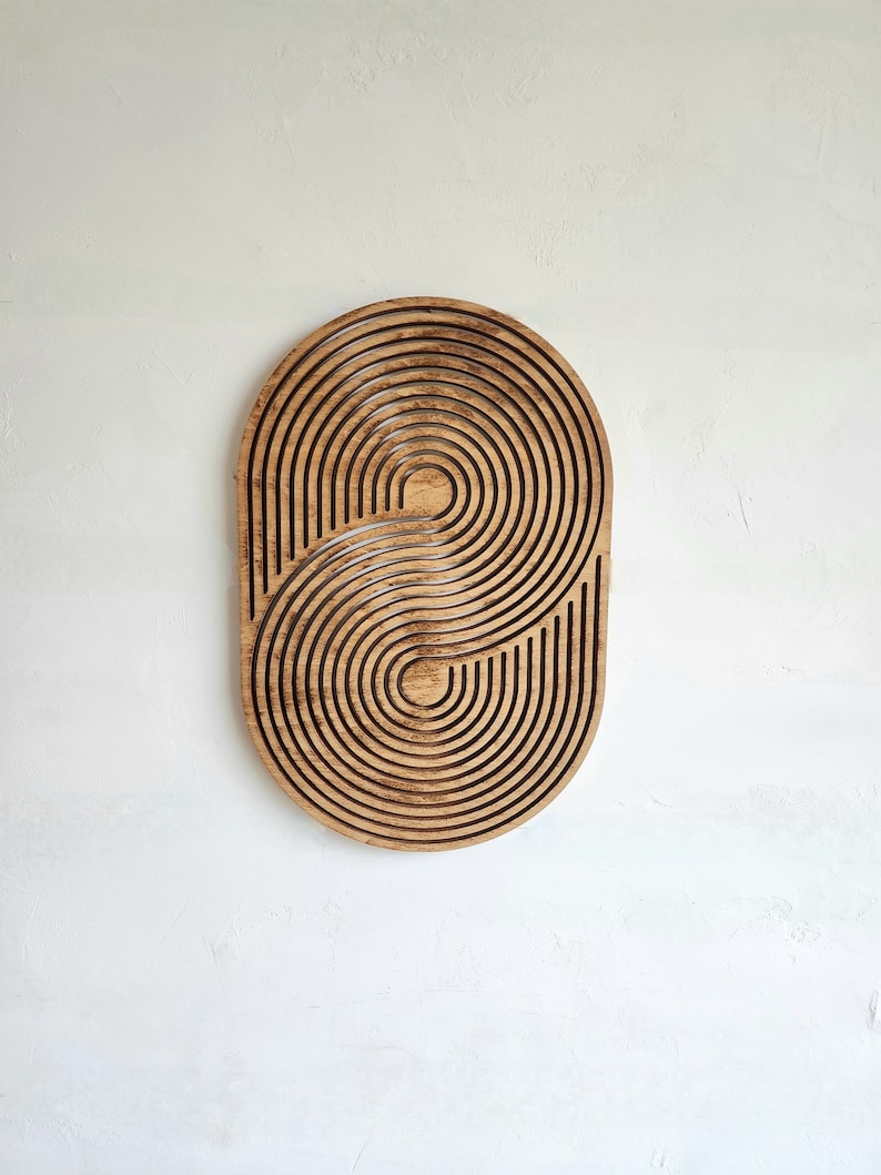 mid century modern wood wall art in a geometric design and oval shape