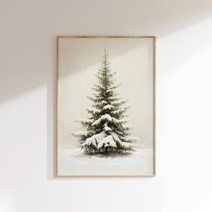 May include: A framed print of a snow-covered evergreen tree against a white background.