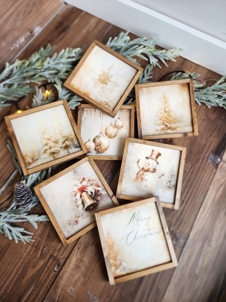 May include: Set of eight framed Christmas-themed prints with a rustic wood frame. The prints feature winter scenes, ornaments, a snowman, a bell, and a Christmas greeting.