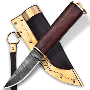 May include: A knife with a Damascus steel blade and a wooden handle. The knife is in a leather sheath with brass accents.