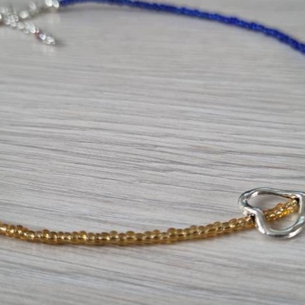 Womens Choker Style Minimalist Necklace. Red, Yellow/Gold and Blue Glass Seed Beads (featuring an antique silver Heart charm)