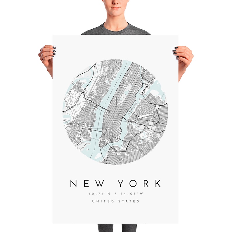 May include: A minimalist poster featuring a black and white map of New York City in a circle on a white background. The city name "NEW YORK" is printed in black below the map, along with the coordinates "40.71&deg;N / 74.01&deg;W" and "UNITED STATES".