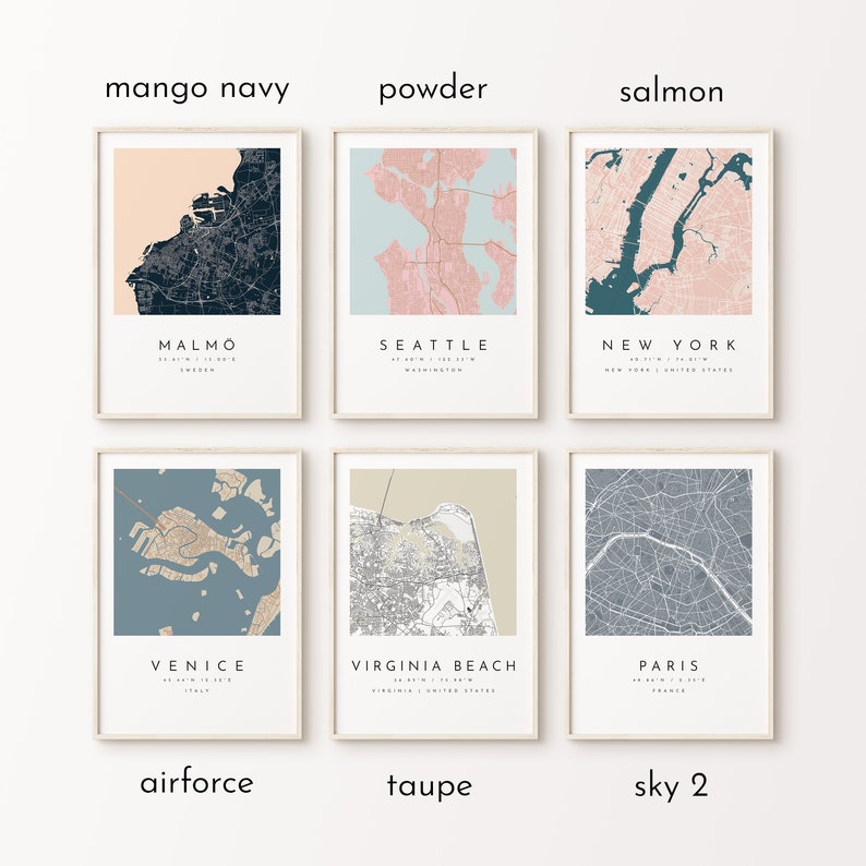 May include: Six framed city map prints in various color schemes, including mango navy, powder, and salmon. Each print features a different city name, such as Malmo, Seattle, and New York, with coordinates and country information.