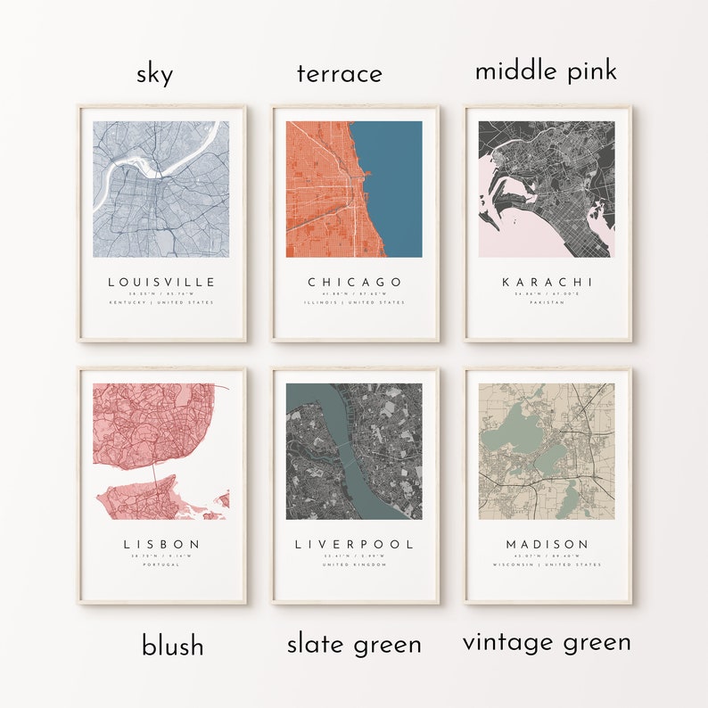 May include: Six framed city map prints in various colors, including sky blue, coral, and pink. Each print features a detailed map of a city, with the city name and coordinates displayed below. Cities include Louisville, Chicago, Karachi, Lisbon, Liverpool, and Madison.