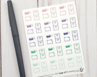 May include: A sheet of stickers featuring various file folder and USB drive icons in a gradient of pink, purple, blue, green, and teal.