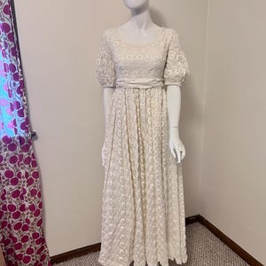 Vintage wedding dress • 1960s wedding gown • Bianchi Boutiques • cream lace • empire waist • short sleeves • flowy