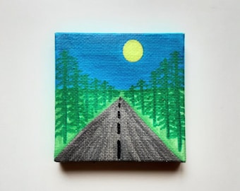 May include: A painting of a road leading through a forest with a yellow sun in the blue sky.