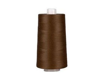 May include: A spool of brown thread with a white top and bottom. The thread is tightly wound around the spool, creating a cylindrical shape. The thread appears to be a medium brown color.
