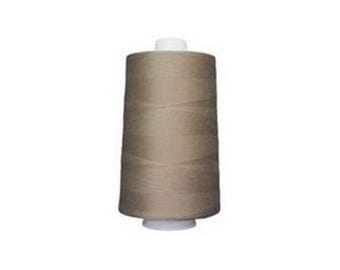 May include: A spool of tan thread, tightly wound around a cylindrical core. The thread is a neutral, light brown color, and the spool has white plastic ends. Ideal for sewing, quilting, or other fabric crafts.
