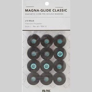 May include: A package of Magna-Glide Classic magnetic core pre-wound bobbins. The bobbins are black, with a teal center, and are made of filament polyester. The package includes 12 bobbins and features the text "MAGNA-GLIDE CLASSIC" and "FIL-TEC".