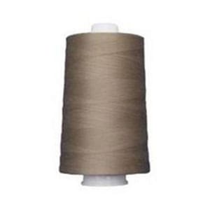 May include: A spool of tan thread, tightly wound around a white base. The thread is a solid, neutral color, suitable for various sewing projects. The spool is cylindrical and stands upright.