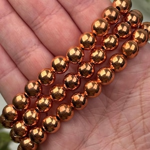 Pulseira de cobre | 8 mm | - Nº 631 (Joia com cristal laranja polido, todos os chakras, energia)