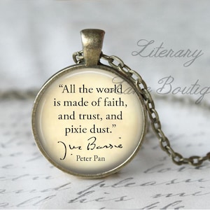 May include: A bronze necklace with a round pendant featuring a quote from J.M. Barrie's Peter Pan: "All the world is made of faith, and trust, and pixie dust."