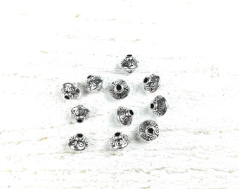 20 perles toupie en métal couleur argenté +/- 6.5 x 7.5mm