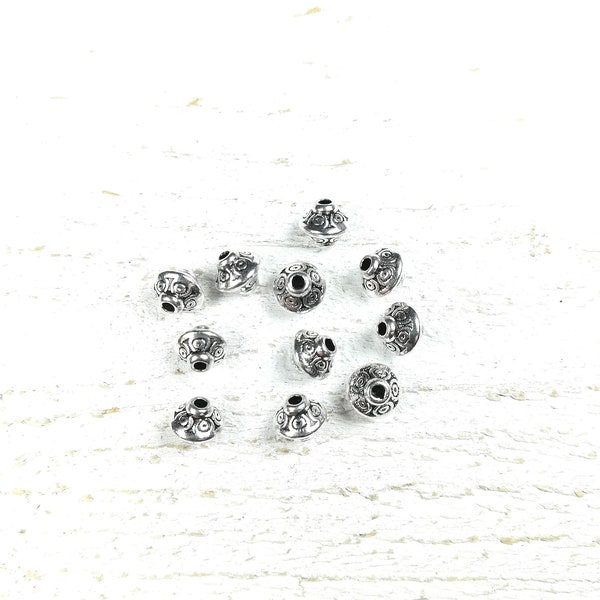 20 perles toupie en métal couleur argenté +/- 6.5 x 7.5mm