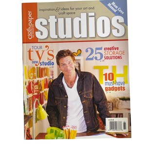 May include: A magazine cover titled "studios" with a man in a denim jacket. The cover includes text such as "inspiration & ideas for your art and craft space", "25 creative storage solutions", and "10 must-have gadgets".