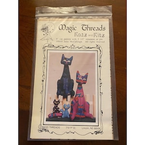 May include: A pattern for making cat ornaments or pins. The pattern is titled "Magic Threads Katz and Kitz" and includes instructions for a 9-inch cat pattern. The image shows four decorative cat figures in various colors and patterns.