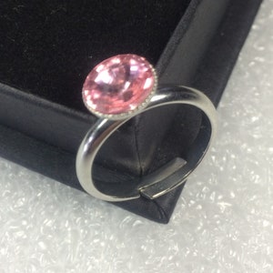 Light rose Swarovski crystal ring with a Titanium plated adjustable base