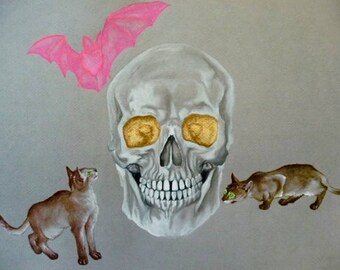May include: A white skull with gold eyes and a pink bat above it. Two brown cats with green eyes are looking at the skull.