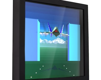 May include: A framed digital art print featuring a pixelated spaceship flying through a blue sky with white clouds and mountains in the background. The spaceship is blue, red, and white. The frame is black.